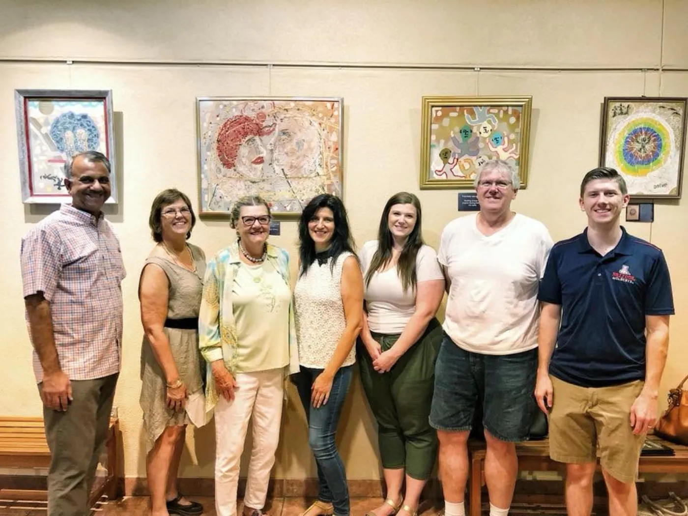 Seven Gilbert Toastmasters members together at a local art exhibition in 2018