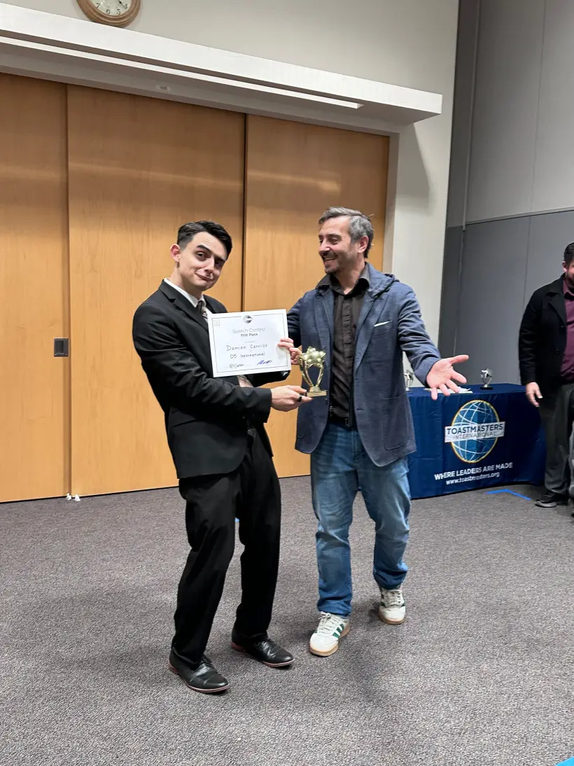 Damian competing on the contest stage for Gilbert Toastmasters in 2026