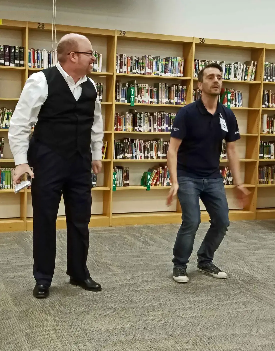 Vincent and Harvey performing a comedic sloth dance during Harvey's Tall Tale speech at the 2019 contest