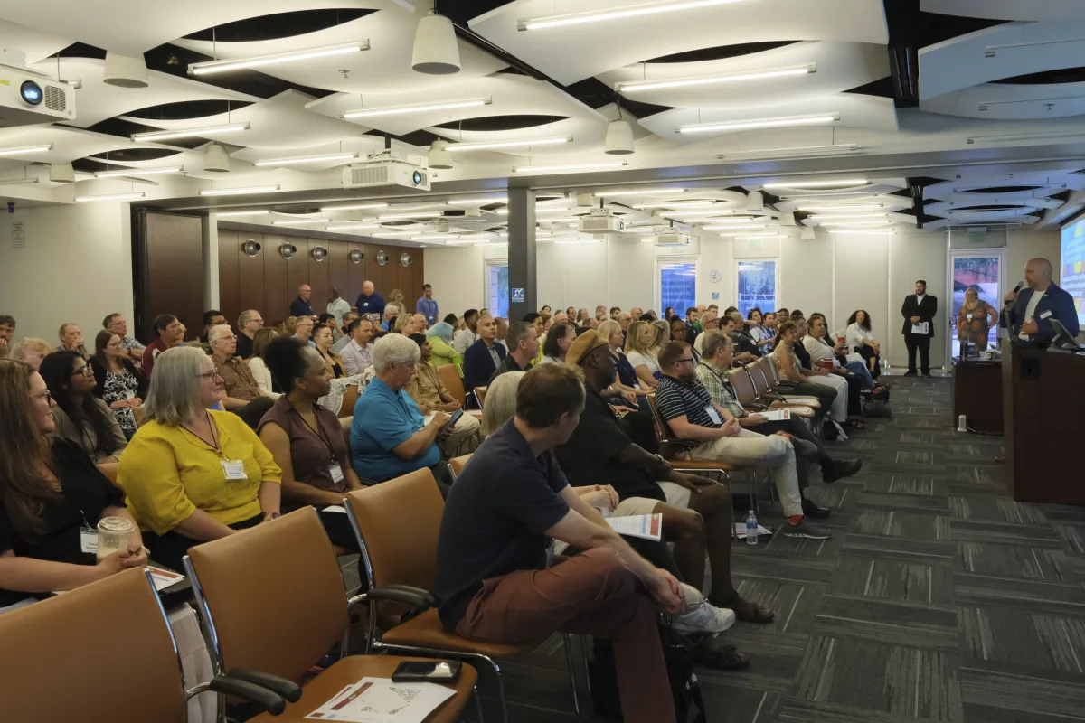 A packed main room of more than 150 Toastmasters officers at the Phoenix Summer TLI