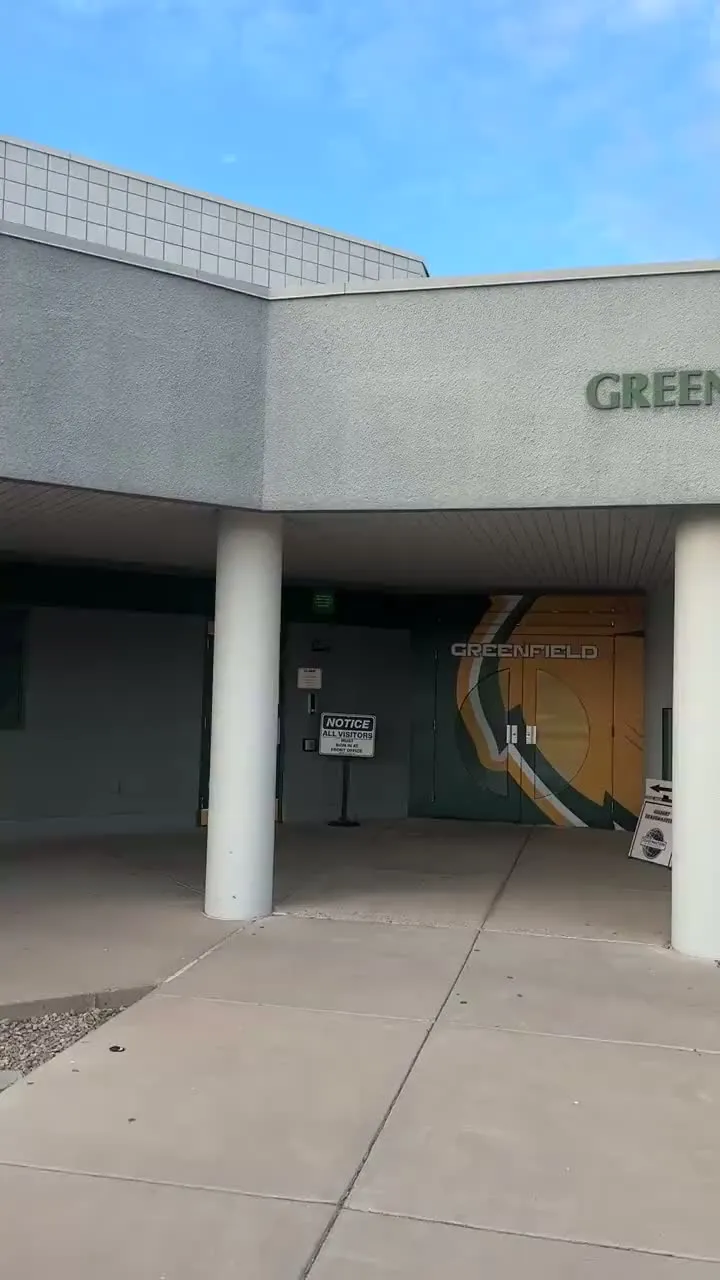 Walking up to the Greenfield Junior High entrance for a meeting